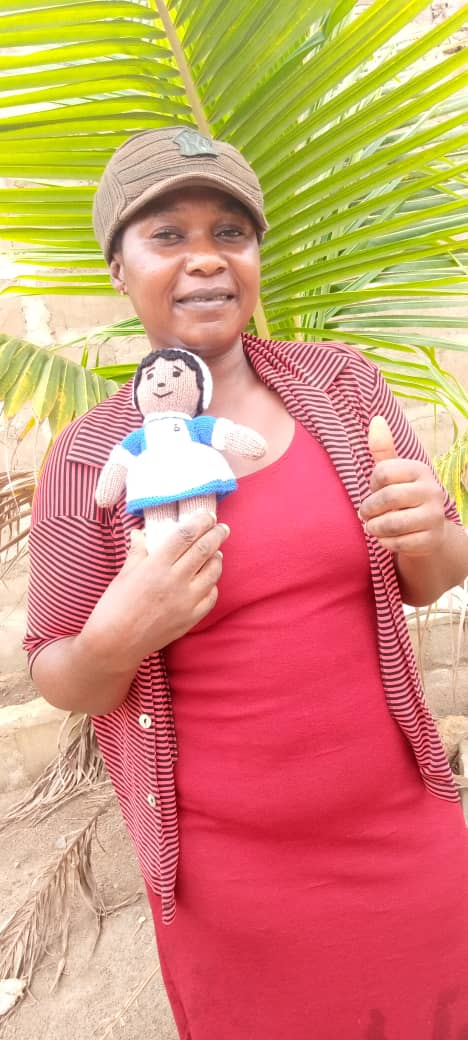 Jane with knitted doll mascot made by a UK supporter